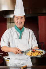 Cook demonstrates his dishes