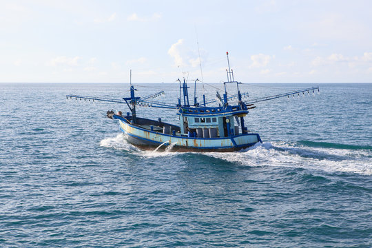 thailand local fishery boat running over blue sea water