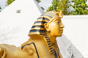 .Sphinx statue with white pyramid