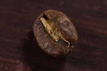macro roasted coffee bean on wooden background
