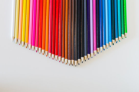 Brightly Colored Pencil Crayons Grouped Together Into a Point Ac