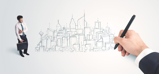 Businessman looking at hand drawn city on wall