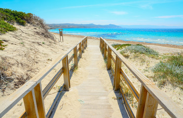 boardwalk to the beach in Capo Testa