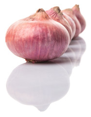 Large red onion over white background