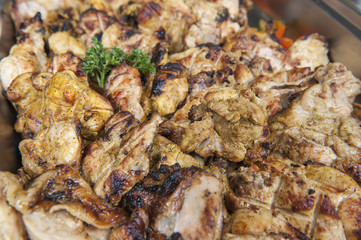Grilled chicken at an oriental restaurant buffet