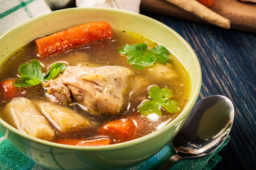 Chicken broth with noodles and carrot