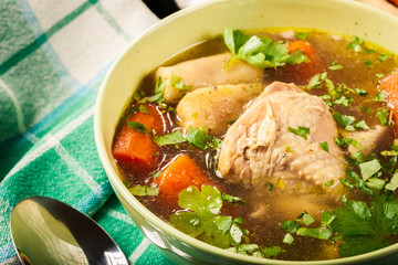Chicken broth with noodles and carrot