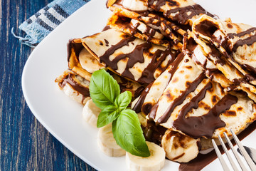 Crepes with banana and chocolate cream