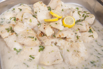 Fish in white sauce at an oriental restaurant buffet