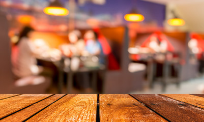 wooden table and  Coffee shop blur background with bokeh image