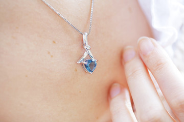 Woman's decollete with a pendant