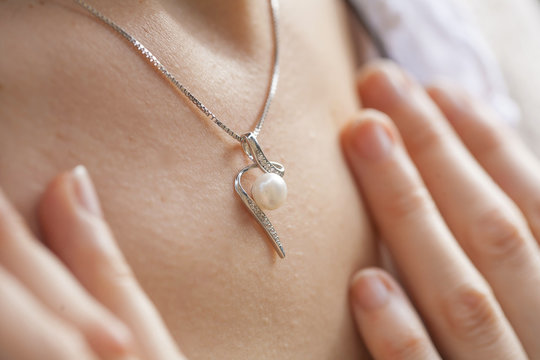 Woman's decollete with a pendant