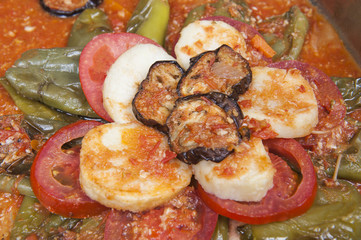 Oriental vegetables in tomato sauce at a restaurant buffet