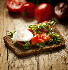 sandwich with feta, tomatoes and herbs, selective focus