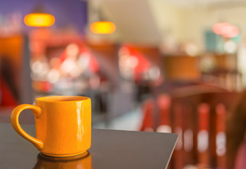 Fototapeta na wymiar Coffee shop blur background with bokeh image