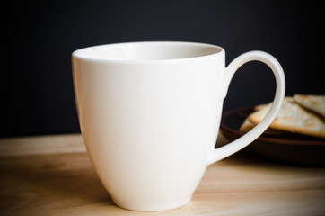 Cup of coffee on wooden table