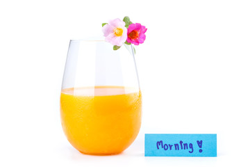Fresh orange juice, pink rosemoss flowers and morning note on wh