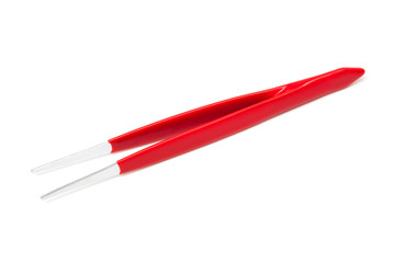 tweezers with a red handle