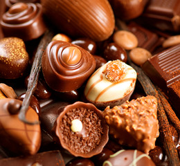 Chocolates background. Praline chocolate sweets