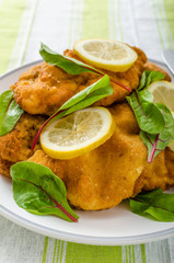 Fried schnitzel with herbs and lemon