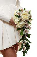 Bridal bouquet of flowers in hands of the bride