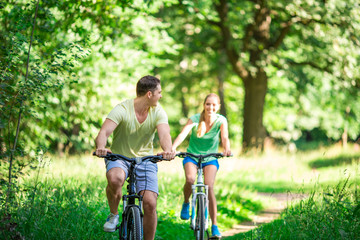 Active people on bicycles in summer