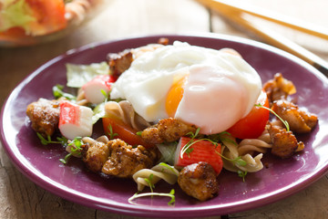 Salad with chicken and poached egg