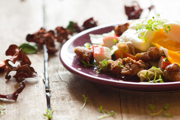 Salad with chicken and poached egg