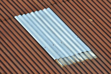 New silver corrugated iron between old. abstract lining backgrou