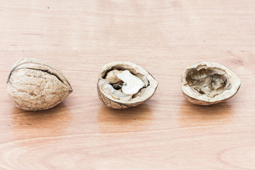 Walnuts on wooden background
