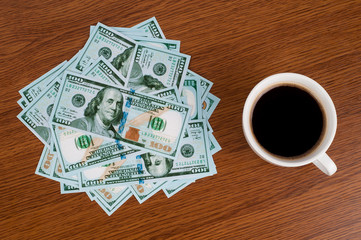 A cup of coffee  in a white cup on wooden background