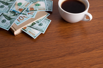 A cup of coffee  in a white cup on wooden background
