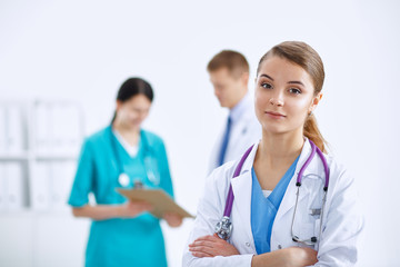 Woman doctor standing with stethoscope at hospital