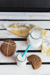 Rustic home made cookies on the wooden background with milk