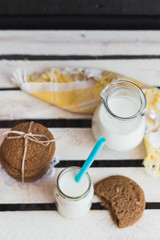 Rustic home made cookies on the wooden background with milk