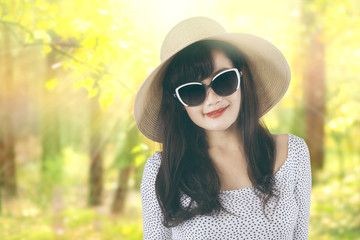 Woman with hat at autumn forest