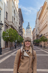 Portrait of a smiling girl in a cap on the Zrinyi street