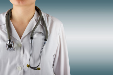 Female doctor and stethoscope on blurred background. Concept of