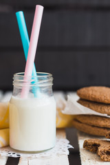 Rustic home made cookies on the wooden background with milk