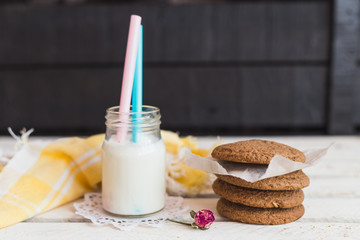 Rustic home made cookies on the wooden background with milk