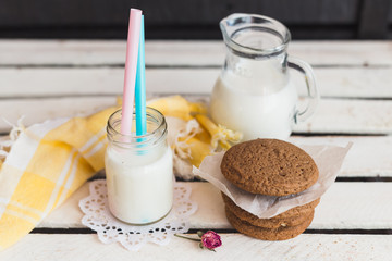 Rustic home made cookies on the wooden background with milk