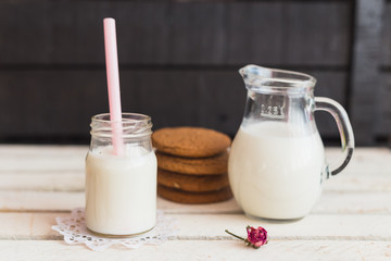 Rustic home made cookies on the wooden background with milk