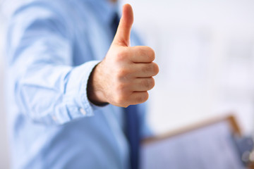 Business man showing ok, hand with thumb up