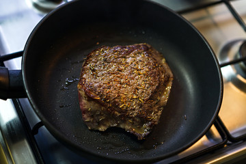 Beef steak fried in the pan