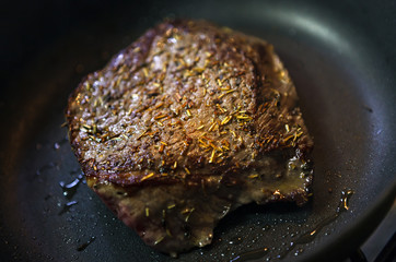 Beef steak fried in the pan