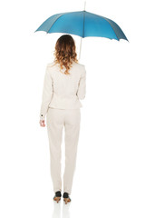 Businesswoman holding an umbrella.