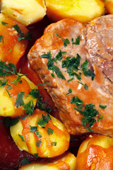 Meat with tomato sauce baked with potatoes