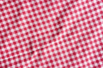 Red and white picnic tablecloth texture.