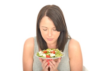 Attractive Healthy Young Woman Holding a Plate of Chicken Salad