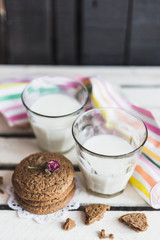 Rustic home made cookies on the wooden background with milk